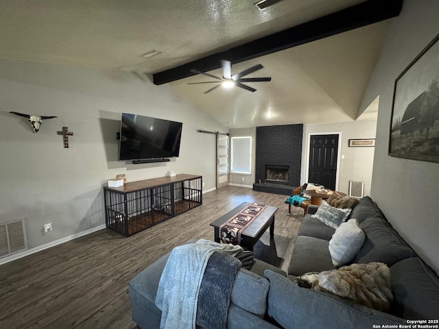 1817 Dusk Dr, Killeen, TX 76543 - living area with ceiling fan, wood finished floors, baseboards, a fireplace, and a barn door