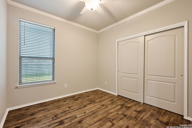 5752 Ping Way, Schertz, TX 78108 - unfurnished bedroom featuring dark wood finished floors, ornamental molding, a closet, baseboards, and a ceiling fan