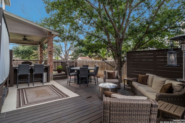 219 Roan Spg, San Antonio, TX 78258 - deck with outdoor dining area, outdoor lounge area, a ceiling fan, and a fenced backyard