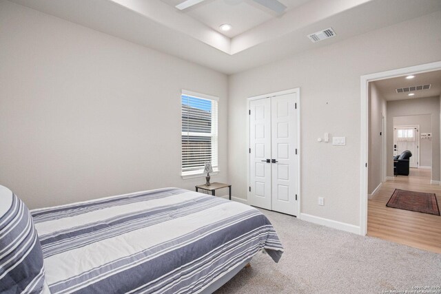 239 Porter, San Antonio, TX 78210 - bedroom with multiple windows, recessed lighting, light carpet, baseboards, and a closet