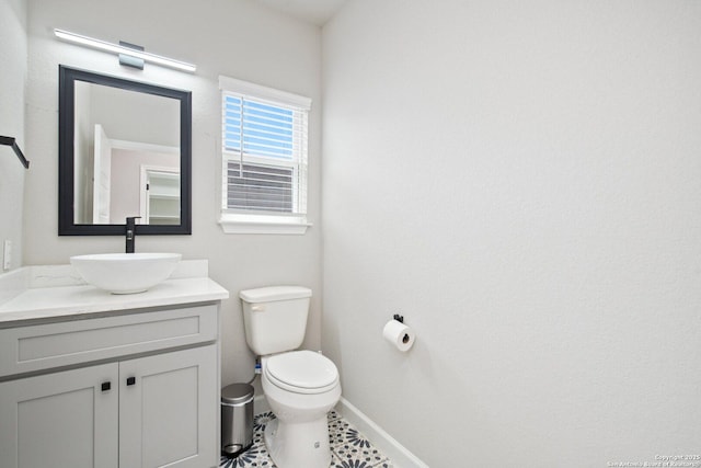 239 Porter, San Antonio, TX 78210 - bathroom featuring vanity, toilet, and baseboards