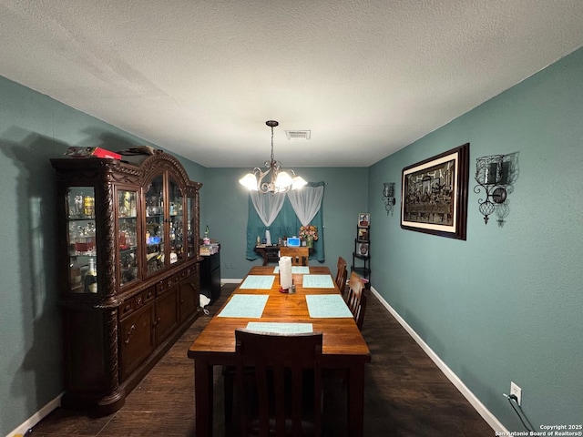 101 Ghent Pl, Portland, TX 78374 - dining space with a chandelier, dark wood-type flooring, baseboards, and a textured ceiling