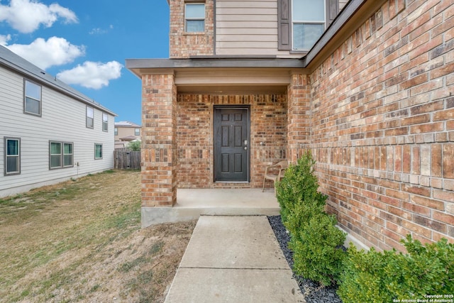 8514 Bayliss Pt, San Antonio, TX 78252 - property entrance featuring brick siding and a yard