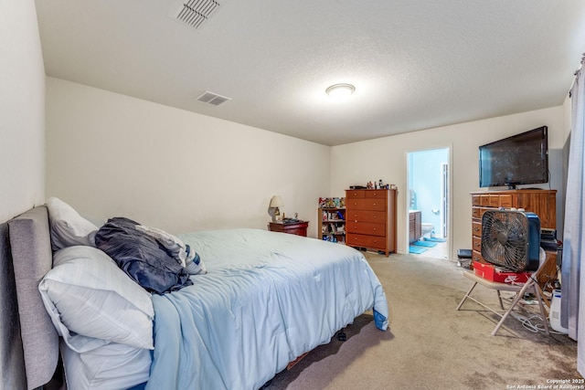 8514 Bayliss Pt, San Antonio, TX 78252 - bedroom with light colored carpet and connected bathroom