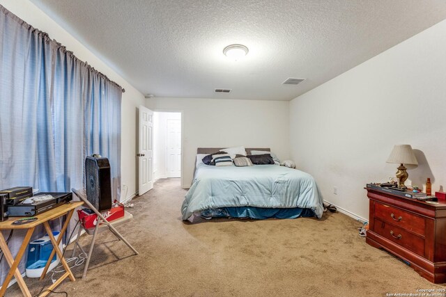 8514 Bayliss Pt, San Antonio, TX 78252 - bedroom featuring carpet floors, a textured ceiling, and baseboards