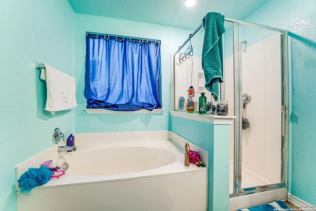 8514 Bayliss Pt, San Antonio, TX 78252 - full bathroom with a bath and a shower stall