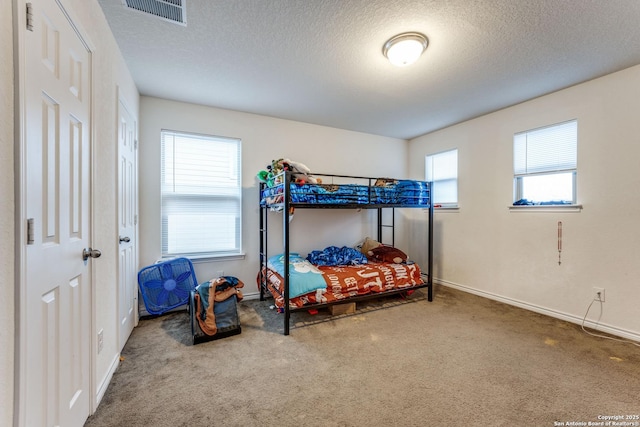 8514 Bayliss Pt, San Antonio, TX 78252 - carpeted bedroom featuring a textured ceiling and baseboards