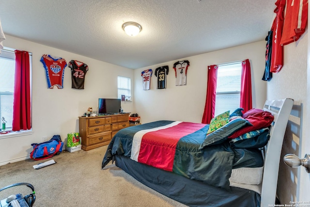 8514 Bayliss Pt, San Antonio, TX 78252 - bedroom with a textured ceiling and carpet