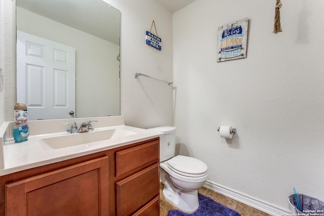 8514 Bayliss Pt, San Antonio, TX 78252 - half bath with toilet, vanity, baseboards, and tile patterned floors