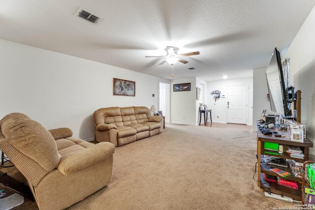 8514 Bayliss Pt, San Antonio, TX 78252 - living room with ceiling fan, carpet, and baseboards