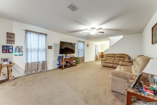 8514 Bayliss Pt, San Antonio, TX 78252 - carpeted living area with ceiling fan and baseboards