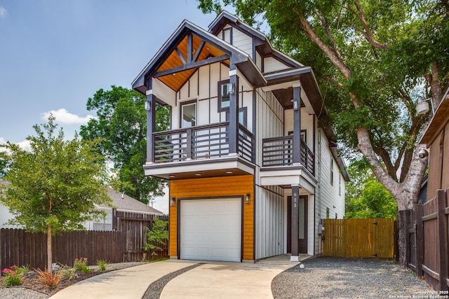 623 Recio St, San Antonio, TX 78225 - view of front of home featuring a balcony, a garage, driveway, and board and batten siding