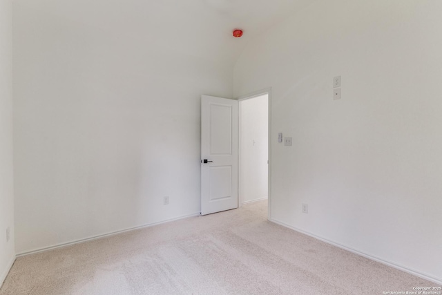 623 Recio St, San Antonio, TX 78225 - spare room with light colored carpet, lofted ceiling, and baseboards