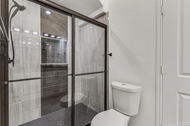 623 Recio St, San Antonio, TX 78225 - full bath with toilet, a shower stall, and a textured wall