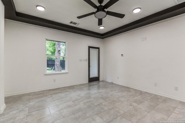 623 Recio St, San Antonio, TX 78225 - spare room with a raised ceiling, a ceiling fan, baseboards, and recessed lighting