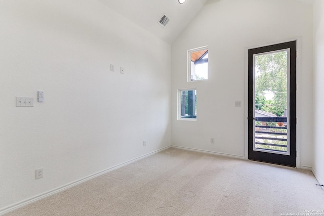 623 Recio St, San Antonio, TX 78225 - empty room with high vaulted ceiling, light colored carpet, and baseboards
