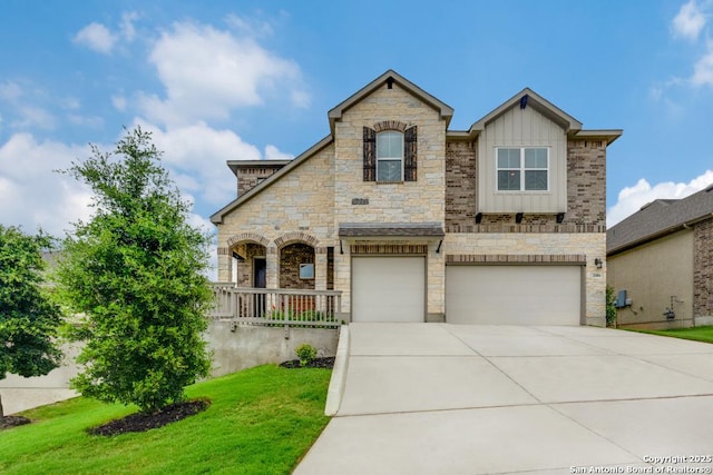 28806 Oldlyme, San Antonio, TX 78260 - view of front of property featuring stone siding, an attached garage, driveway, a front lawn, and board and batten siding