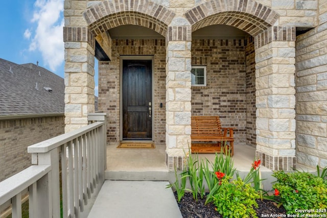 28806 Oldlyme, San Antonio, TX 78260 - doorway to property featuring brick siding, stone siding, and a porch