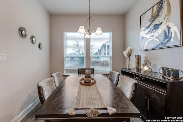 28806 Oldlyme, San Antonio, TX 78260 - dining room with a chandelier, dark wood finished floors, and baseboards