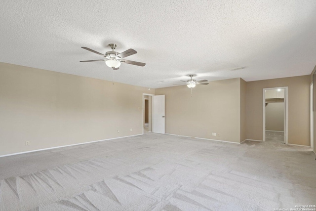 10222 Eagle Blf, San Antonio, TX 78249 - spare room featuring a ceiling fan, baseboards, light carpet, and a textured ceiling