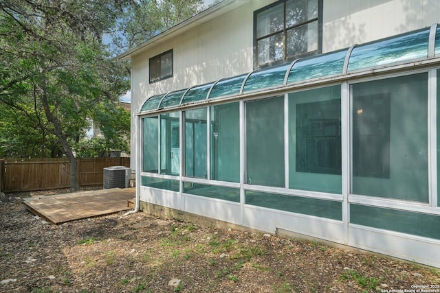 10222 Eagle Blf, San Antonio, TX 78249 - view of property exterior with a sunroom and central air condition unit