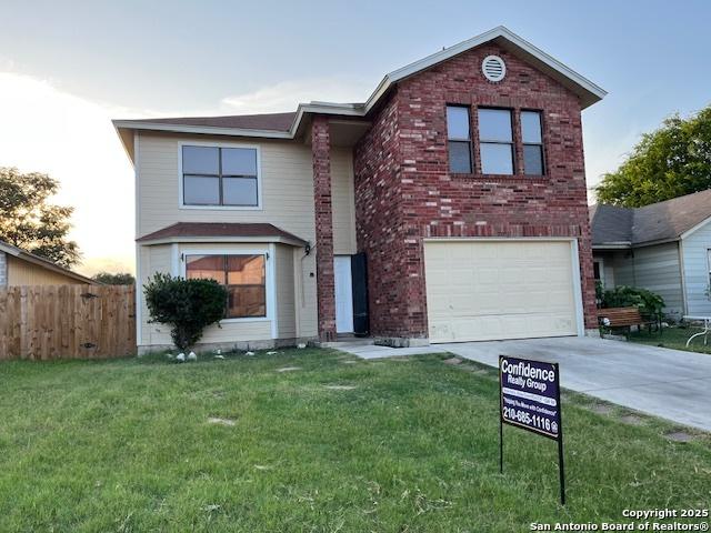 7011 Cole Crk, Converse, TX 78109 - traditional home featuring an attached garage, concrete driveway, and brick siding