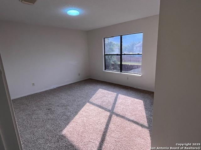 7011 Cole Crk, Converse, TX 78109 - unfurnished room with carpet flooring and baseboards