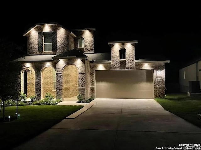 10828 Bango Farms, San Antonio, TX 78254 - french country inspired facade with brick siding, concrete driveway, and an attached garage