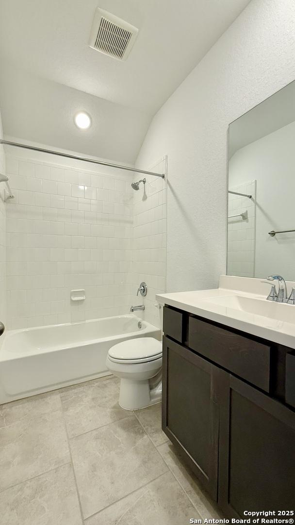 10828 Bango Farms, San Antonio, TX 78254 - full bath with vanity, bathtub / shower combination, and toilet