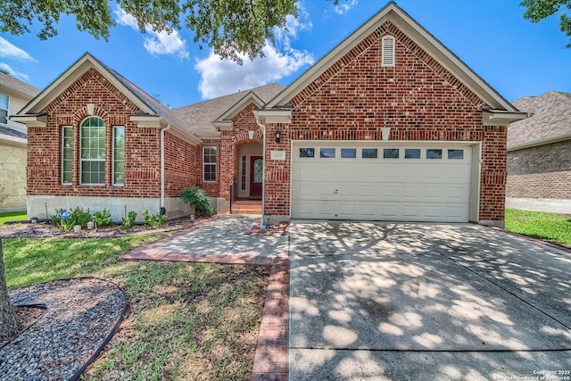 1009 Oak Rdg, Schertz, TX 78154 - view of front facade featuring brick siding, a garage, concrete driveway, and a shingled roof