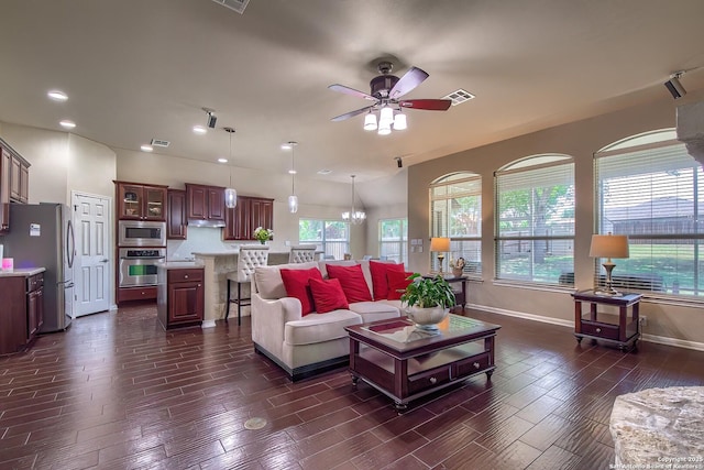 1009 Oak Rdg, Schertz, TX 78154 - living room with ceiling fan, baseboards, healthy amount of natural light, wood tiled floors, and recessed lighting