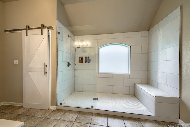 1009 Oak Rdg, Schertz, TX 78154 - full bathroom featuring a shower stall, vaulted ceiling, tile patterned floors, and baseboards
