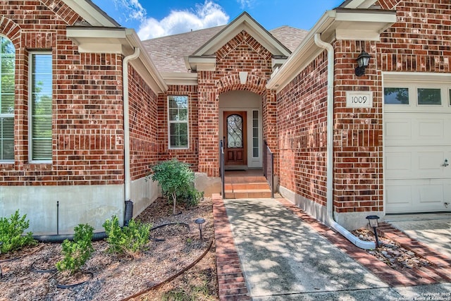 1009 Oak Rdg, Schertz, TX 78154 - doorway to property with brick siding, a garage, and a shingled roof