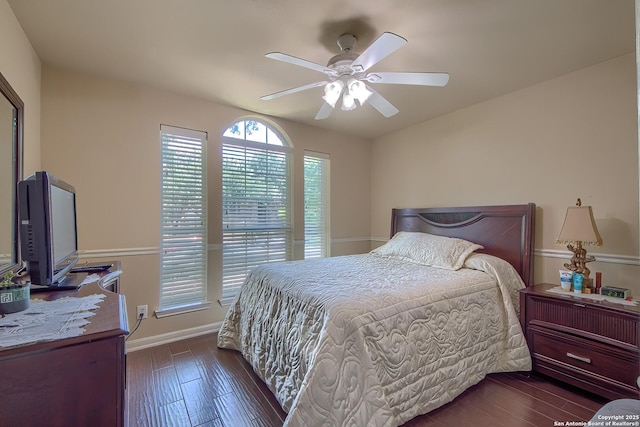 1009 Oak Rdg, Schertz, TX 78154 - bedroom featuring wood finished floors, baseboards, and a ceiling fan