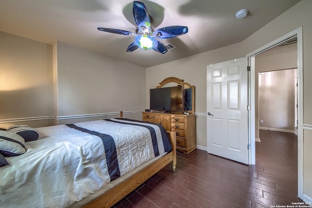 1009 Oak Rdg, Schertz, TX 78154 - bedroom featuring dark wood finished floors, a ceiling fan, and baseboards