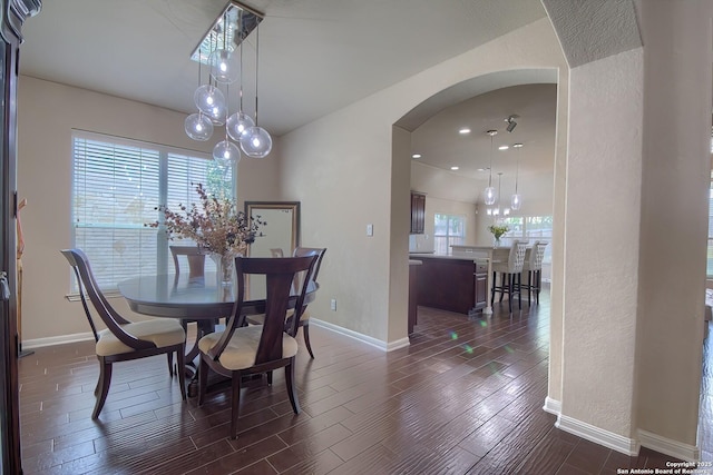 1009 Oak Rdg, Schertz, TX 78154 - dining area with arched walkways, baseboards, dark wood-style flooring, and recessed lighting