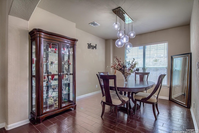 1009 Oak Rdg, Schertz, TX 78154 - dining room with baseboards and dark wood-type flooring