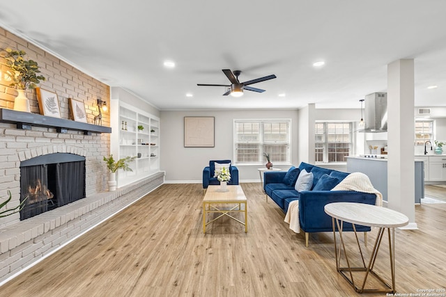 371 Pike, San Antonio, TX 78209 - living area featuring ceiling fan, light wood-type flooring, recessed lighting, a fireplace, and built in shelves