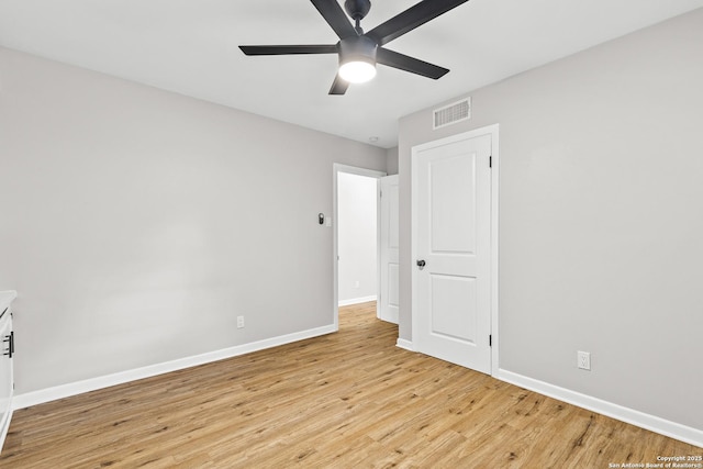 371 Pike, San Antonio, TX 78209 - unfurnished bedroom featuring baseboards, light wood-style flooring, and a ceiling fan