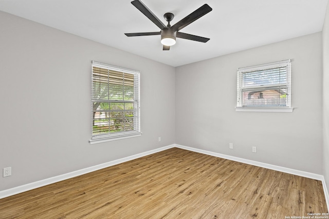 371 Pike, San Antonio, TX 78209 - spare room featuring baseboards, healthy amount of natural light, wood finished floors, and a ceiling fan