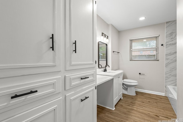 371 Pike, San Antonio, TX 78209 - full bath with vanity, toilet, baseboards, wood finished floors, and recessed lighting