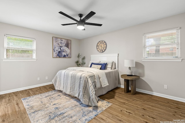 371 Pike, San Antonio, TX 78209 - bedroom featuring multiple windows, wood finished floors, and baseboards