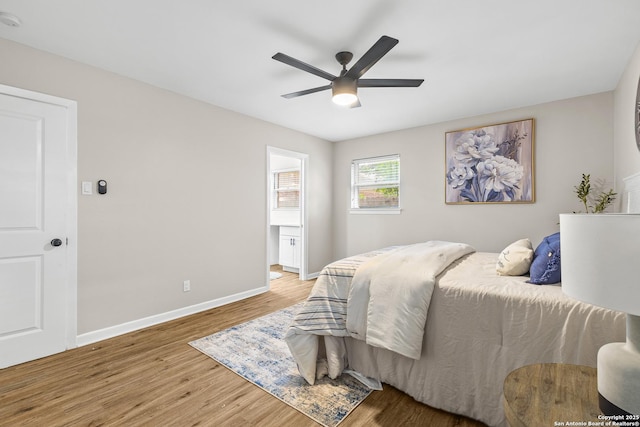371 Pike, San Antonio, TX 78209 - bedroom featuring wood finished floors, baseboards, ceiling fan, and connected bathroom