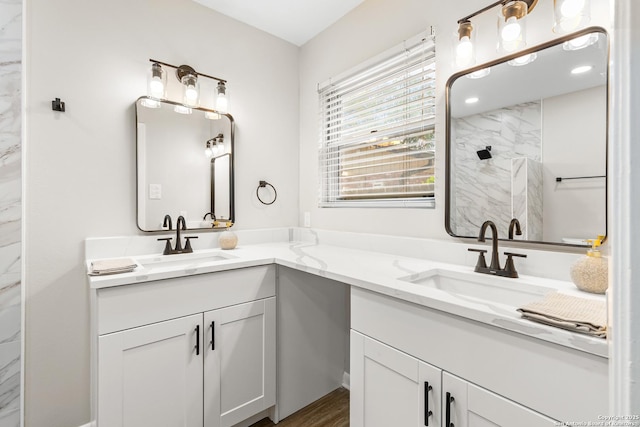 371 Pike, San Antonio, TX 78209 - bathroom featuring double vanity, a marble finish shower, and wood finished floors