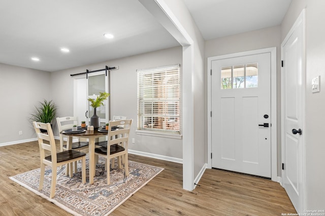 371 Pike, San Antonio, TX 78209 - foyer with a barn door, baseboards, light wood-style floors, and recessed lighting