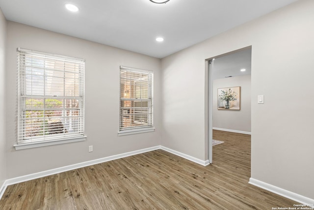 371 Pike, San Antonio, TX 78209 - unfurnished room with wood finished floors, baseboards, and recessed lighting