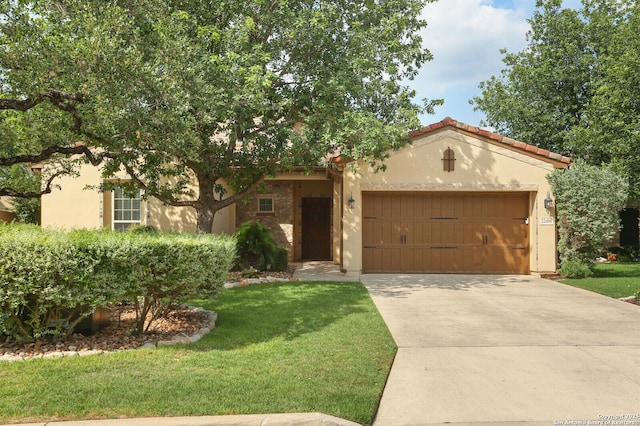 22450 Viajes, San Antonio, TX 78261 - mediterranean / spanish home with an attached garage, driveway, a front yard, and stucco siding
