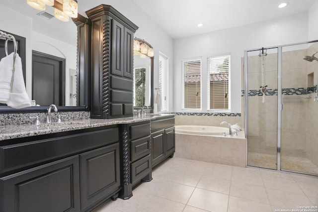 22450 Viajes, San Antonio, TX 78261 - bathroom with a shower stall, double vanity, a bath, tile patterned floors, and recessed lighting