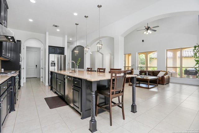 22450 Viajes, San Antonio, TX 78261 - kitchen with a sink, ceiling fan, arched walkways, open floor plan, and recessed lighting