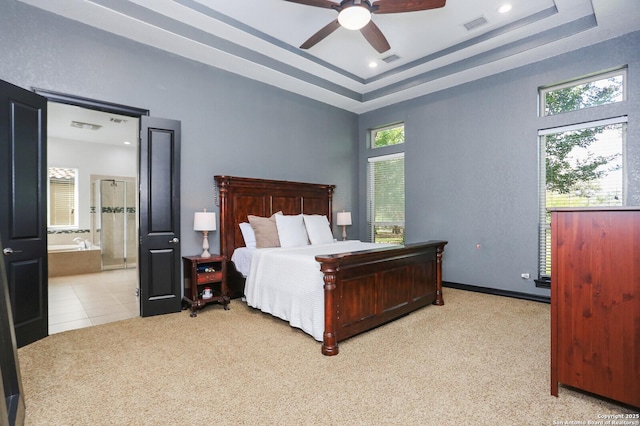 22450 Viajes, San Antonio, TX 78261 - carpeted bedroom featuring a raised ceiling, connected bathroom, recessed lighting, and a ceiling fan